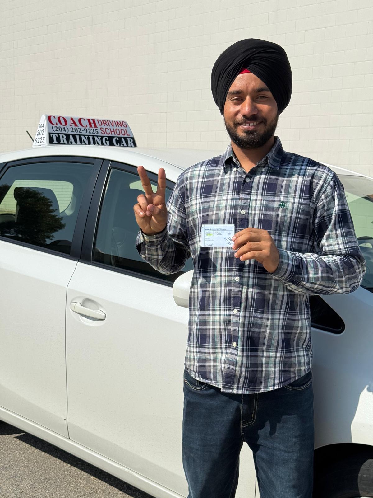 Happy student holding license